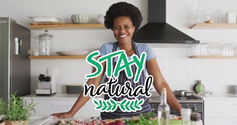 Smiling Woman Cooking in Home Kitchen with Stay Natural Message