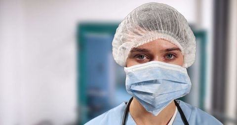 Female Surgeon Wearing Protective Cap and Mask in Hospital - Download Free Stock Images Pikwizard.com
