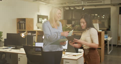 Collaborative Women Solving Problems in Modern Office