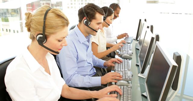 Customer Service Team Working at Desks in a Call Center - Download Free Stock Images Pikwizard.com