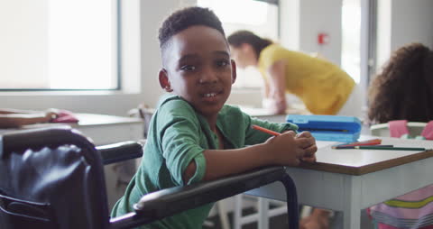 Cheerful Boy in Classroom Enjoying School Activities