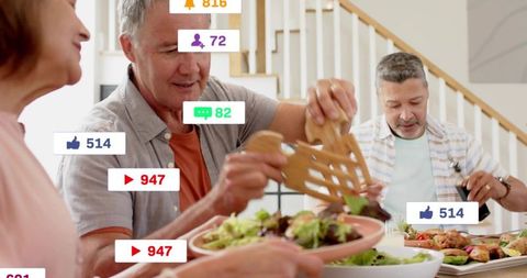 Adults serving salad at home dining table with social media reaction overlays and casual gathering