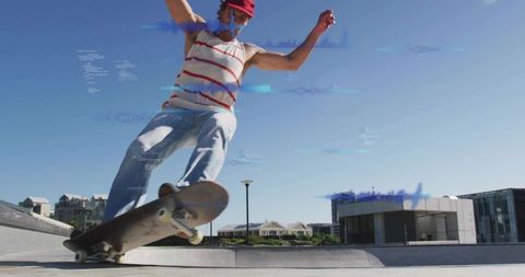 Skater grinding on urban curb performing skateboard trick in sunlit concrete plaza