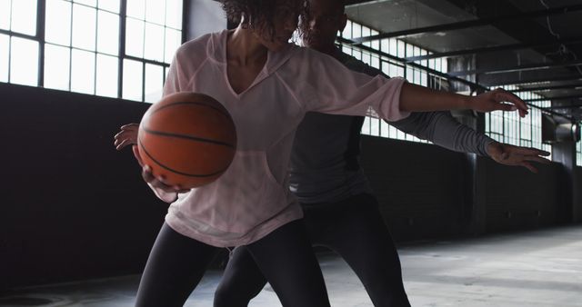 Two Athletes Playing Basketball Indoors in Dramatic Lighting - Download Free Stock Images Pikwizard.com