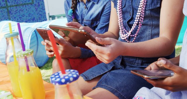 Kids Using Smartphones Outdoors at Summer Picnic - Download Free Stock Images Pikwizard.com