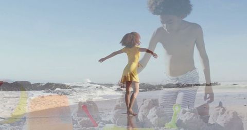 Joyful Family Day at the Beach with Sandcastles