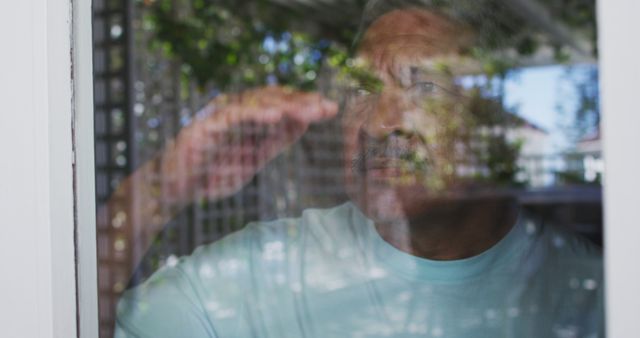 Senior Man Looking Through Window Surrounded by Nature - Download Free Stock Images Pikwizard.com