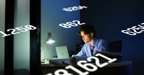 Businessman Analyzing Data on Laptop in Dim Office - Download Free Stock Images Pikwizard.com