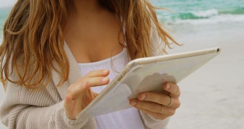 Woman Relaxing on Beach with Tablet Close-Up - Download Free Stock Images Pikwizard.com