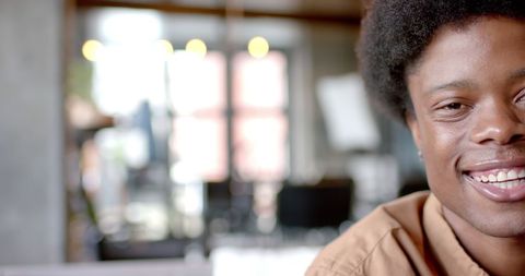 Smiling African American Man with Afro in Modern Home Interior - Download Free Stock Images Pikwizard.com