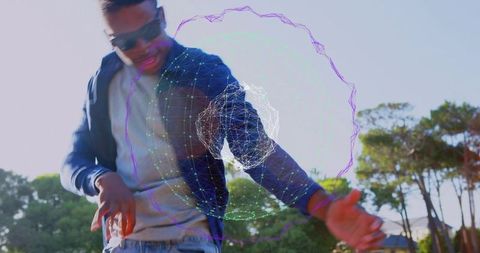 Reaching man interacting with futuristic holographic orb in sunny park