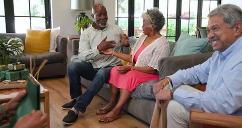 Seniors Celebrating Birthday with Gifts and Laughter