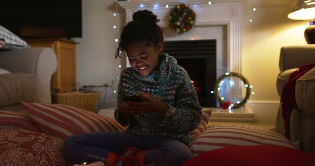 Smiling Child Sitting on Cushions with Lit Candles - Download Free Stock Images Pikwizard.com