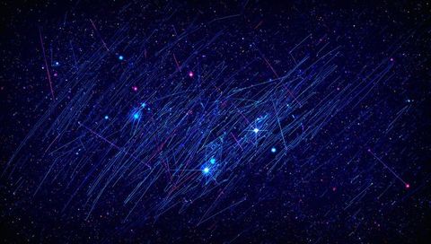 Vivid Celestial Star Cluster with Blue Streaks Across Galaxy