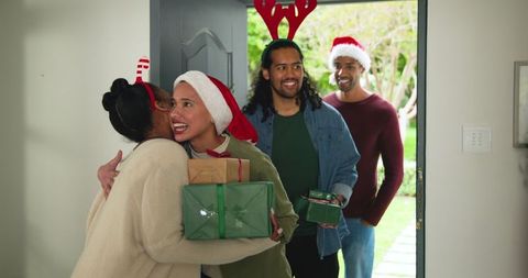 Diverse friends celebrating festive holiday with gifts and joy