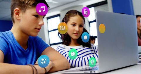 Schoolchildren Engaging with Digital Icons on Laptop - Download Free Stock Images Pikwizard.com