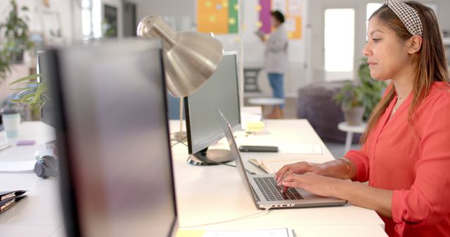 Woman Working on Laptop at Modern Open Office Space - Download Free Stock Images Pikwizard.com