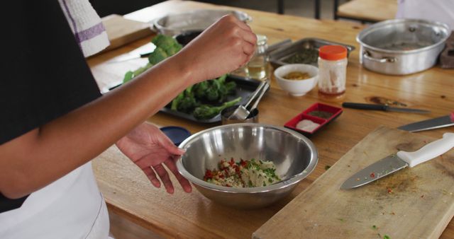 Close-Up of Hands Preparing Healthy Salad in Kitchen - Download Free Stock Images Pikwizard.com