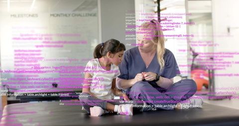 Instructor adjusting child's foot during stretching session with code overlay in studio
