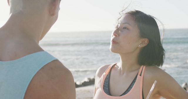 Young Couple Enjoying Conversation by the Beach - Download Free Stock Images Pikwizard.com