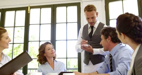 Business Meeting in Restaurant Ordering Lunch