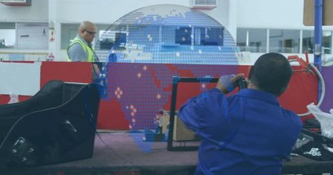 Technician evaluating metal frame with digital globe graphic focus on innovation
