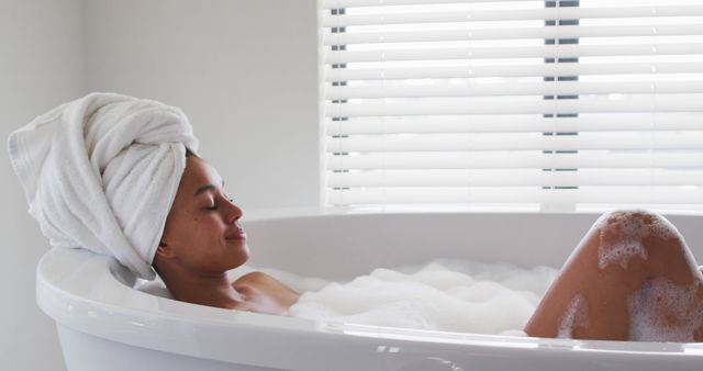 Woman Relaxing in Bathtub with Towels and Bubbles - Download Free Stock Images Pikwizard.com