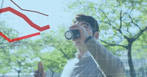 Young professional drinking coffee and eating sandwich outdoors with analytics overlay