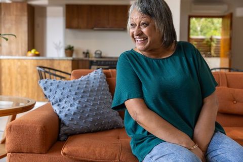 Senior woman relaxing in modern home environment