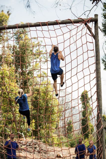 People Climbing Net During Obstacle Course in Boot Camp - Download Free Stock Images Pikwizard.com