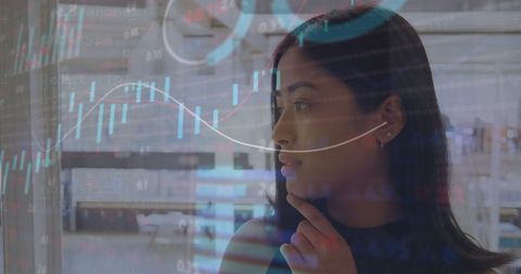 Businesswoman Analyzing Stock Market Data in Office Setting