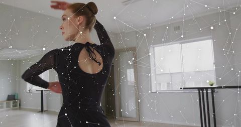 Ballet Dancer Stretches Gracefully at Barre in Minimalist Studio