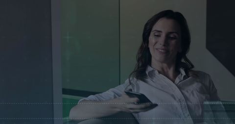 Businesswoman Checks Smartphone with Financial Data Overlay