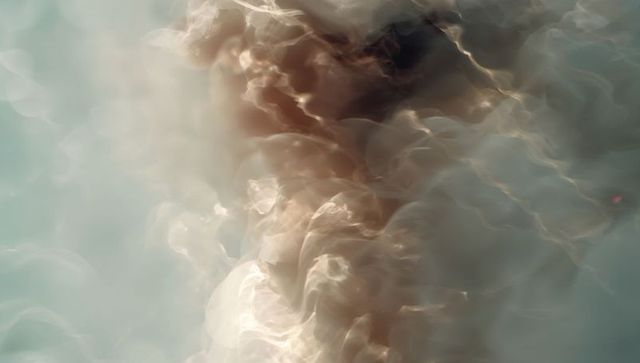 Ethereal translucent plumes flowing in luminous abstract column with soft light streaks