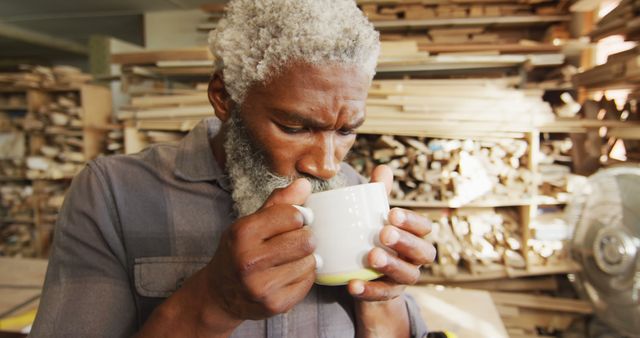 Senior Woodworker Enjoying Hot Drink in Cozy Workshop - Download Free Stock Images Pikwizard.com