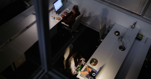 Professionals Working Late in Modern Office with Computers - Download Free Stock Images Pikwizard.com