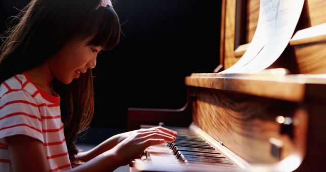 Young Girl Practicing Piano in Sunlit Room - Download Free Stock Images Pikwizard.com