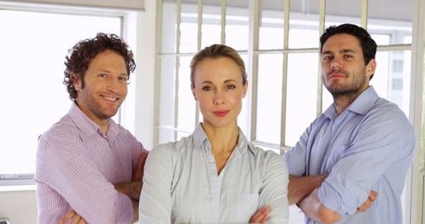 Confident Business Team with Arms Crossed in Modern Office - Download Free Stock Images Pikwizard.com