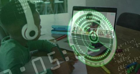 Elementary student learning remotely with augmented reality hud overlay on laptop screen