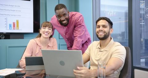 Diverse Team Smiling during Collaborative Office Meeting
