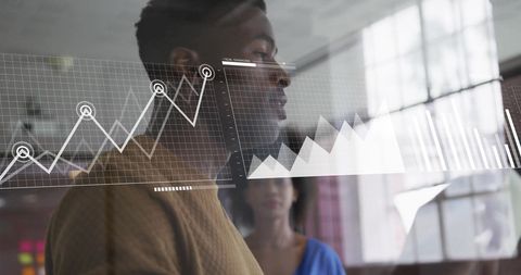Business Professionals Analyzing Financial Graph in Office Setting - Download Free Stock Images Pikwizard.com