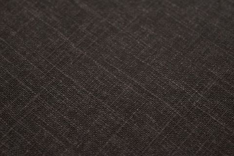Dark charcoal linen texture with subtle crosshatch weave for rustic modern backgrounds