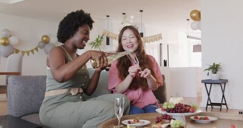 Joyful Celebration with Lesbian Couple and Champagne Toast