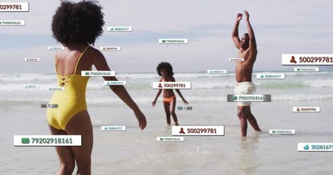 Family walking into surf with floating digital labels and social media data overlay