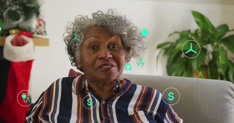 Senior Woman Having Video Call with Digital Icons Overlay