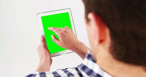 Man Using Tablet with Green Screen for Digital Content - Download Free Stock Images Pikwizard.com
