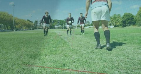Rugby player awaiting teammates on field stirring team spirit outdoors