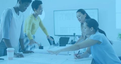 Professional Women Collaborating on Architectural Planning at Office