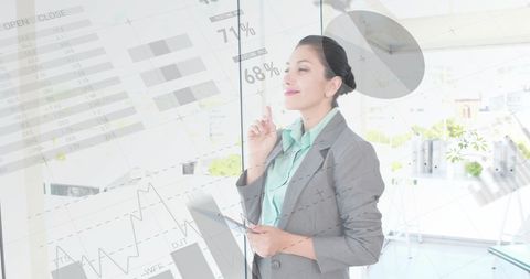 Confident Businesswoman Analyzing Financial Data in Bright Office