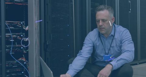 Engineer Analyzing Data in Server Room with Digital Interface - Download Free Stock Images Pikwizard.com